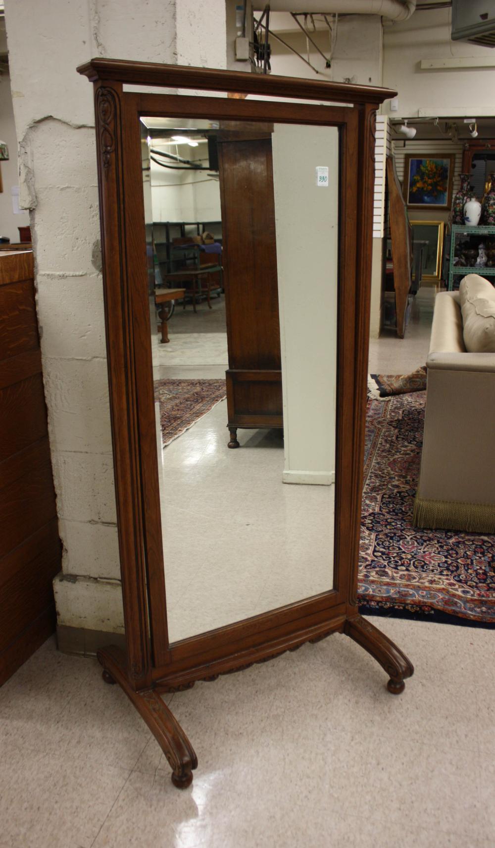 AN OAK FRAMED CHEVAL MIRROR, FLEMISH