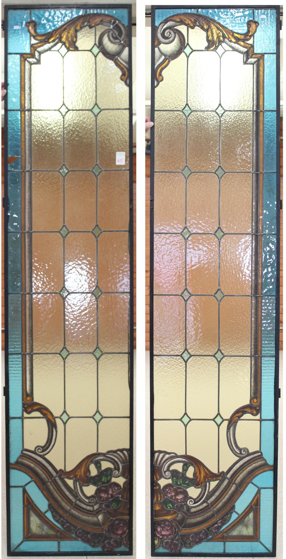 A PAIR OF STAINED AND LEADED GLASS PANEL