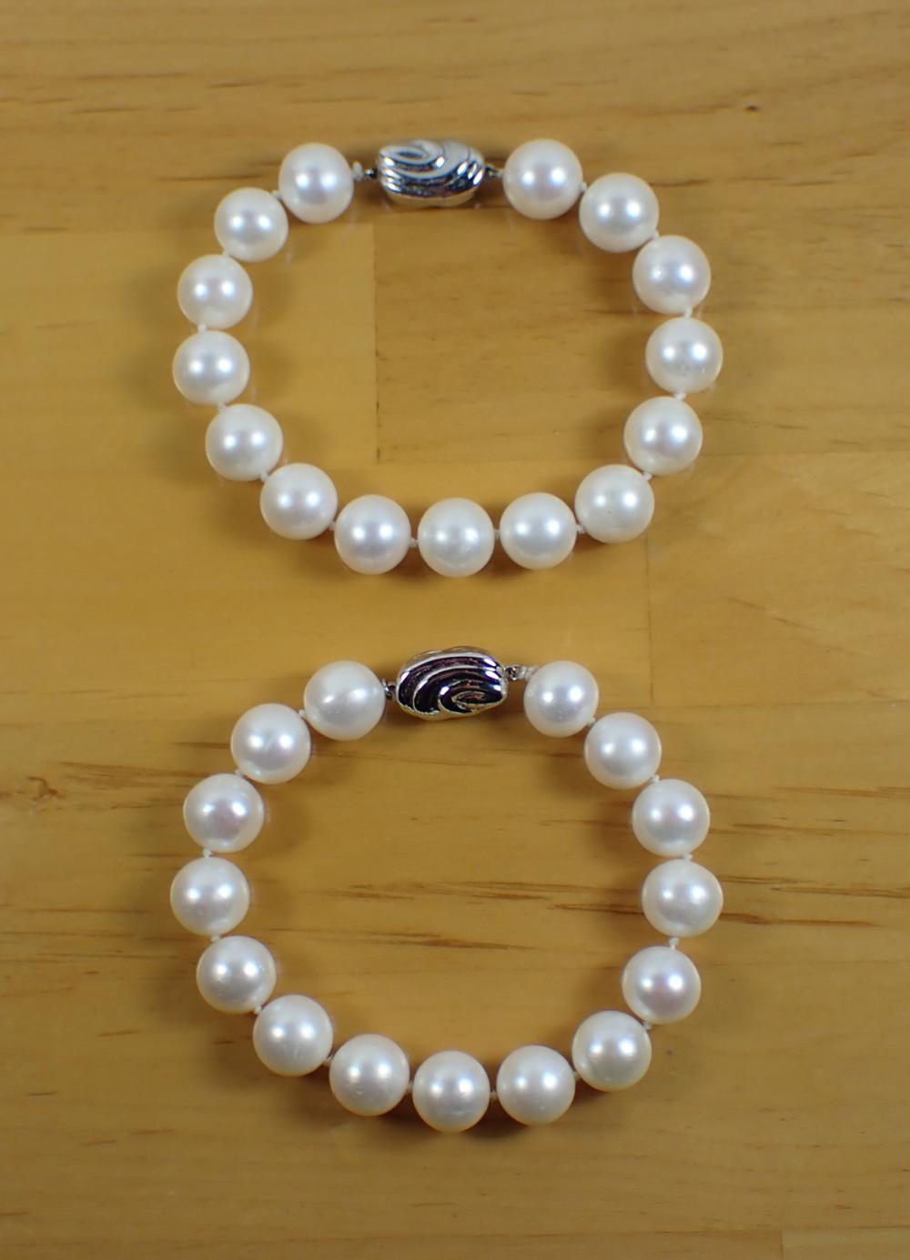 TWO WHITE PEARL HAND KNOTTED BRACELETS  33fb3e