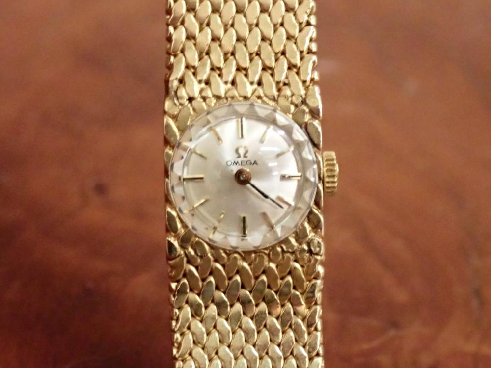 LADIES FOURTEEN KARAT GOLD OMEGA