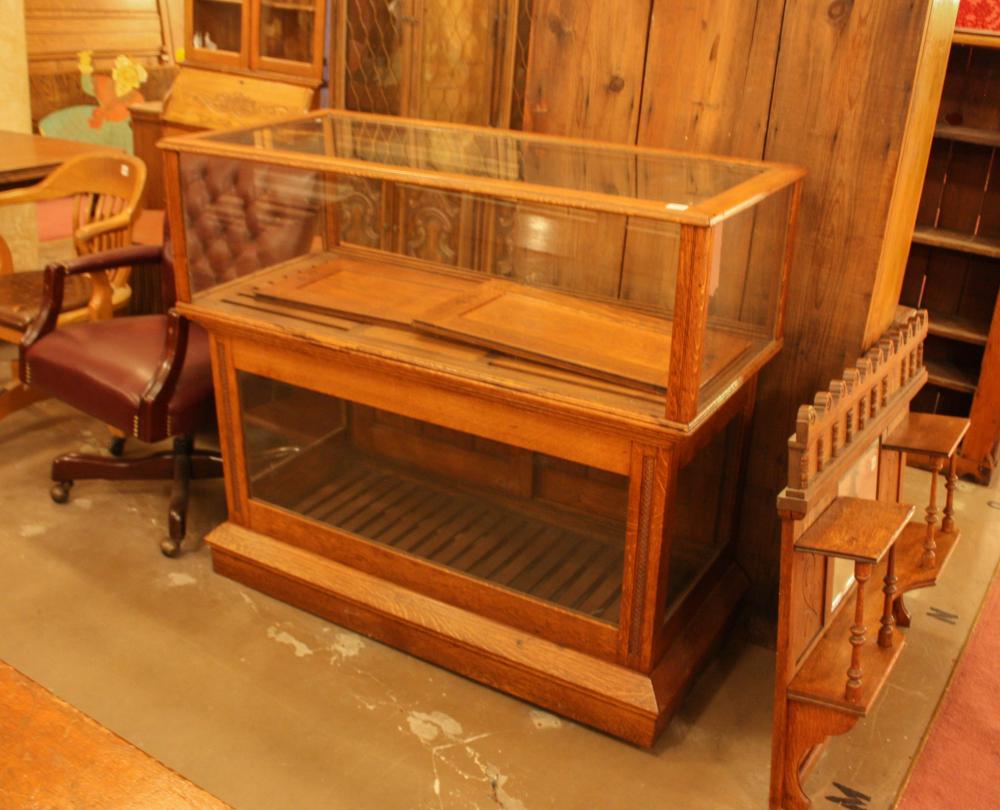 AN ANTIQUE OAK AND GLASS TWO-LEVEL
