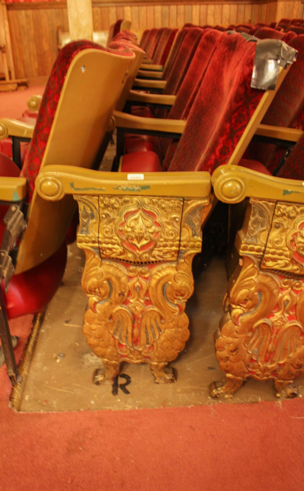 A ROW OF NINE VINTAGE THEATER SEATSA