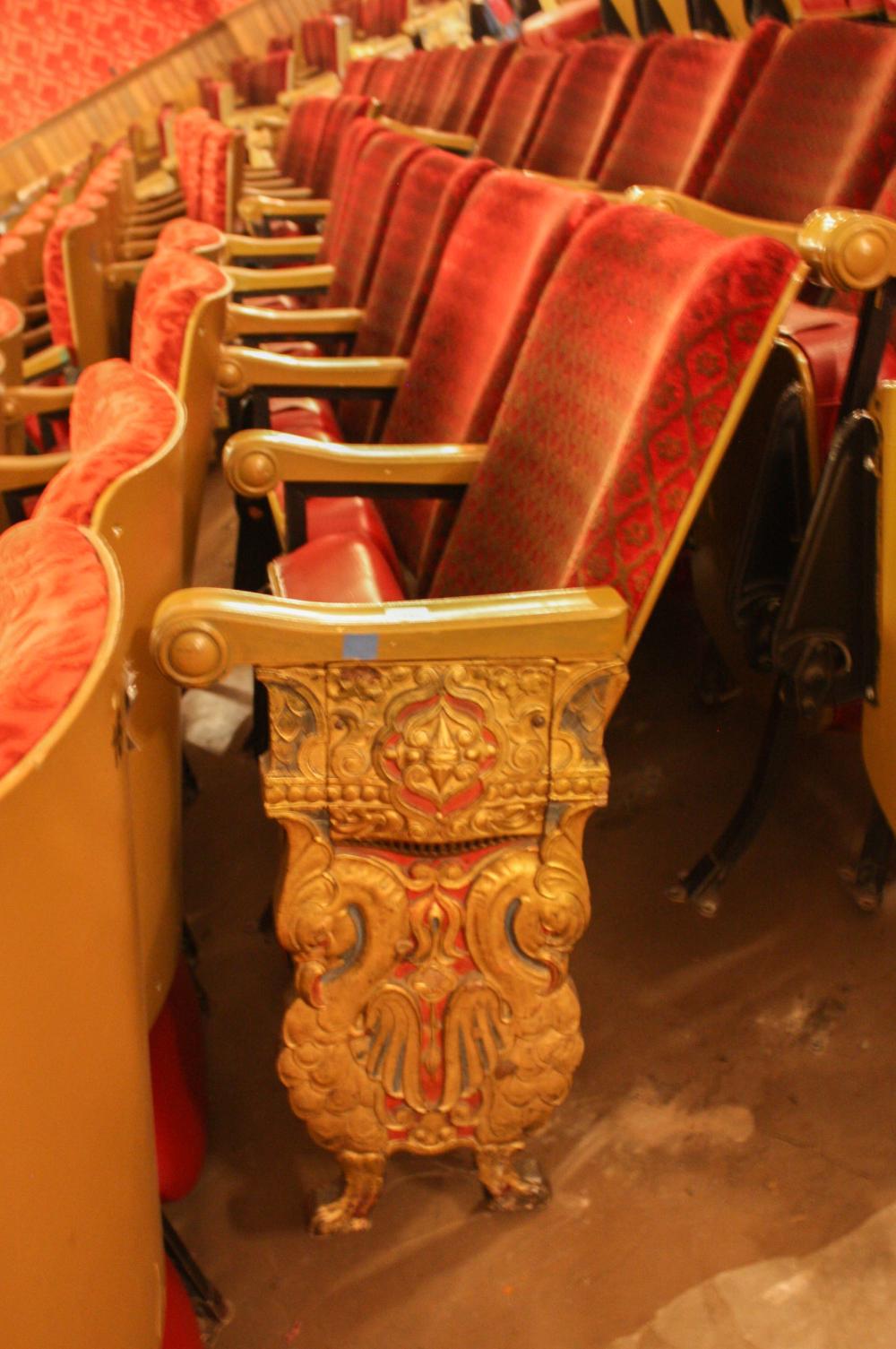 A ROW OF TEN VINTAGE THEATER SEATSA