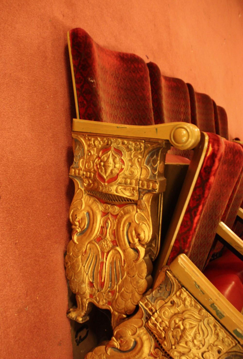 A ROW OF NINE VINTAGE THEATER SEATSA