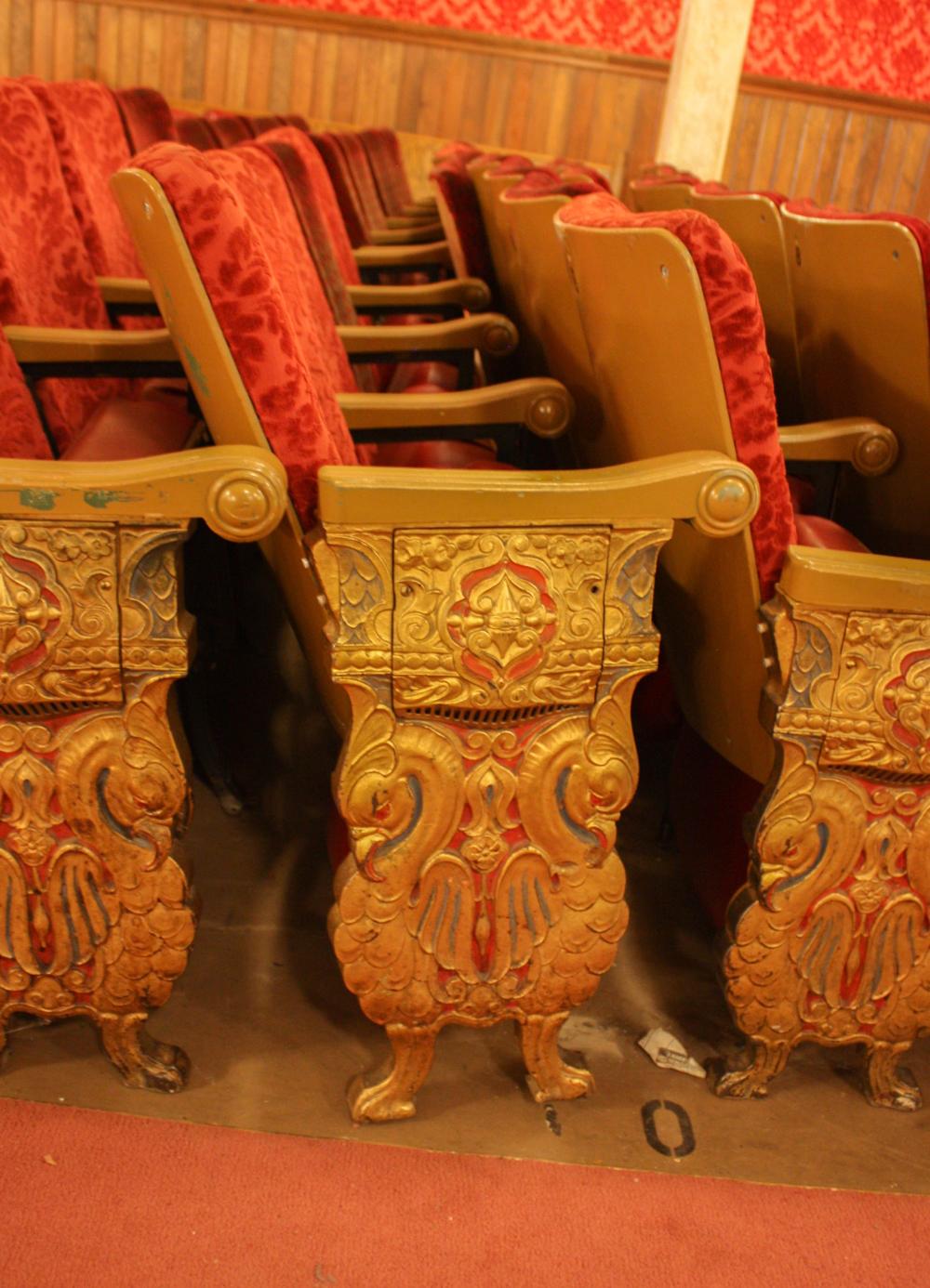 A ROW OF NINE VINTAGE THEATER SEATSA