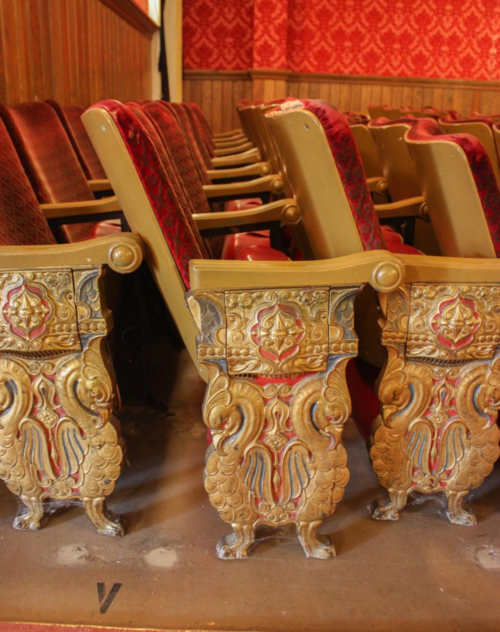 A ROW OF NINE VINTAGE THEATER SEATSA