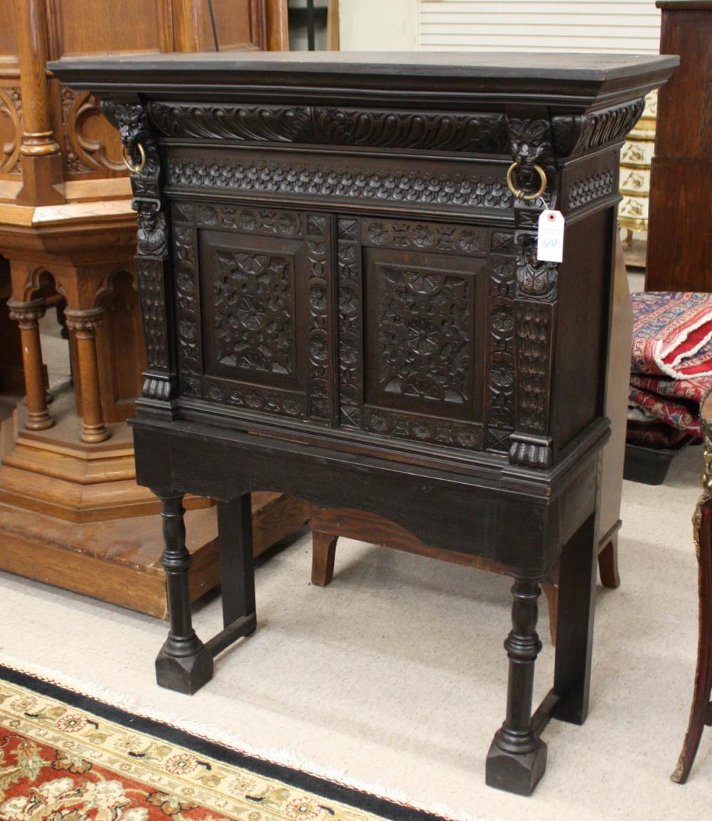 CARVED AND EBONIZED CABINET ON