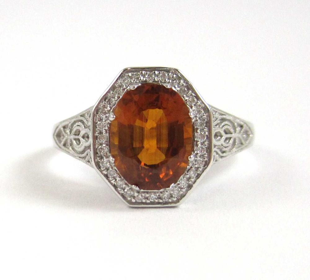 ORANGE SAPPHIRE, DIAMOND AND FOURTEEN