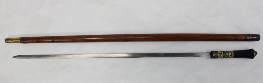 LIONS HEAD SWORD CANE, CARVED WOOD