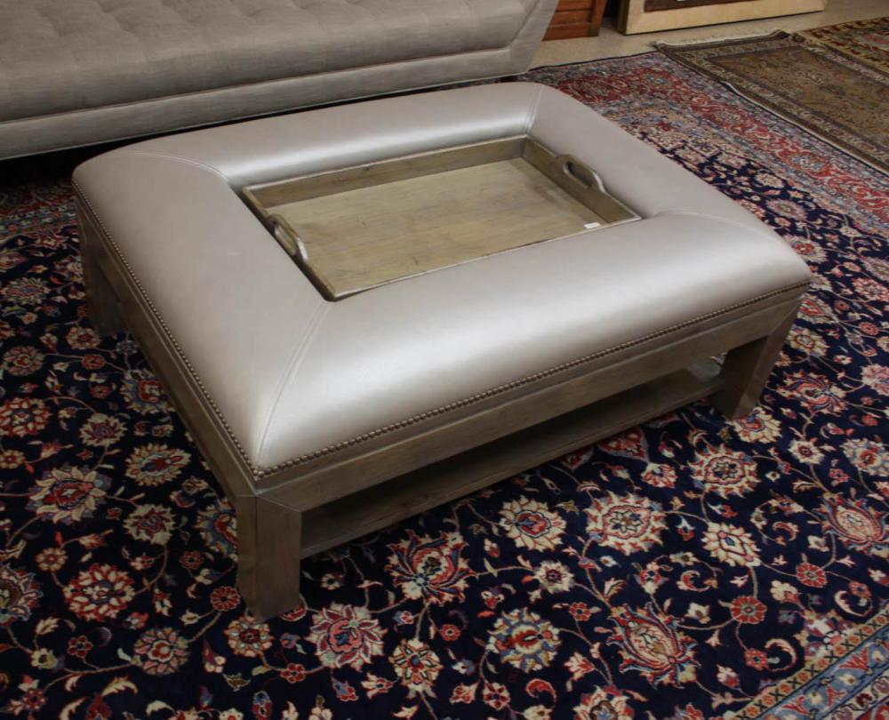 A CONTEMPORARY LEATHER TRAY-TOP OTTOMAN