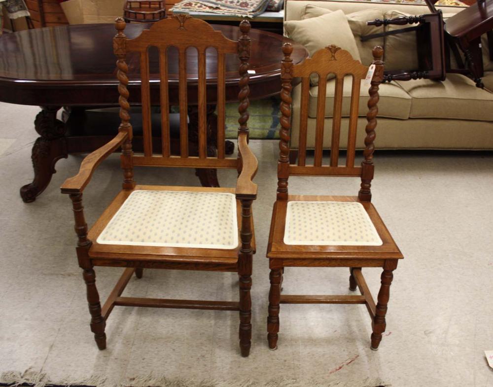 A SET OF SIX OAK DINING CHAIRS,