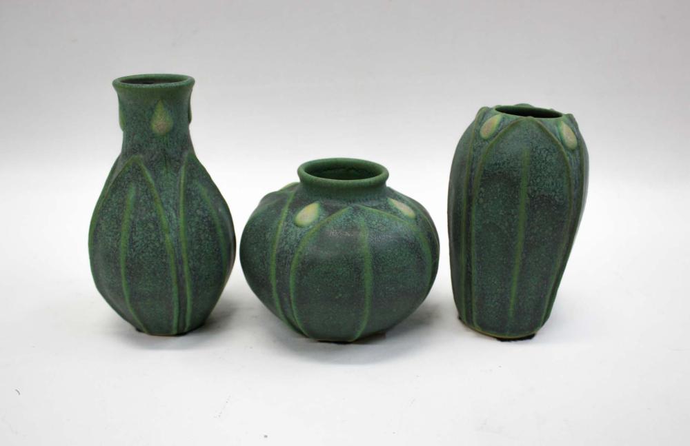 THREE ART POTTERY VASES, MATCHING FLOWER