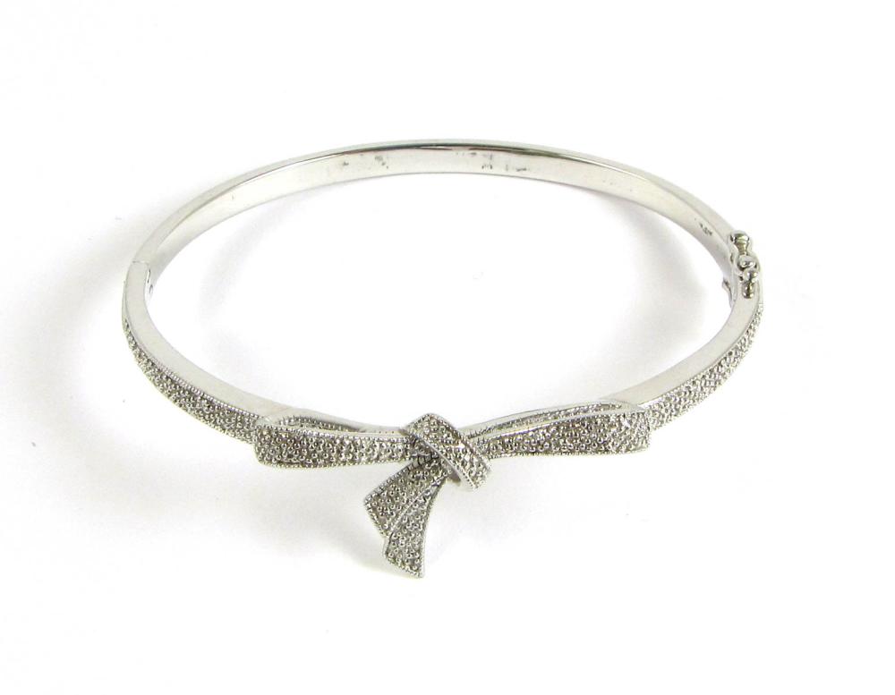 DIAMOND AND STERLING SILVER BANGLE.