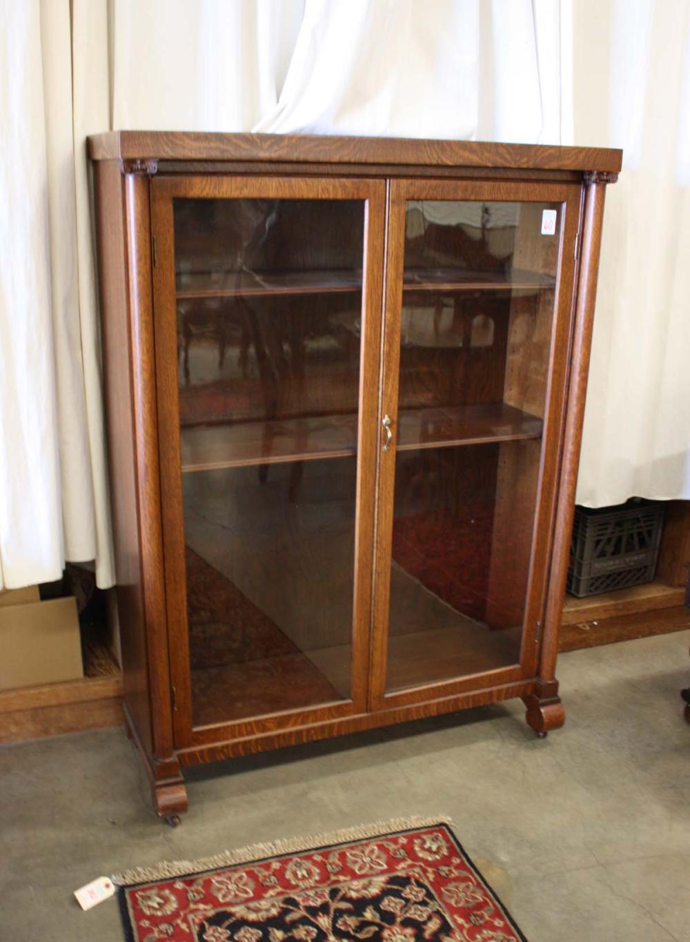 TWO-DOOR OAK CABINET BOOKCASE,