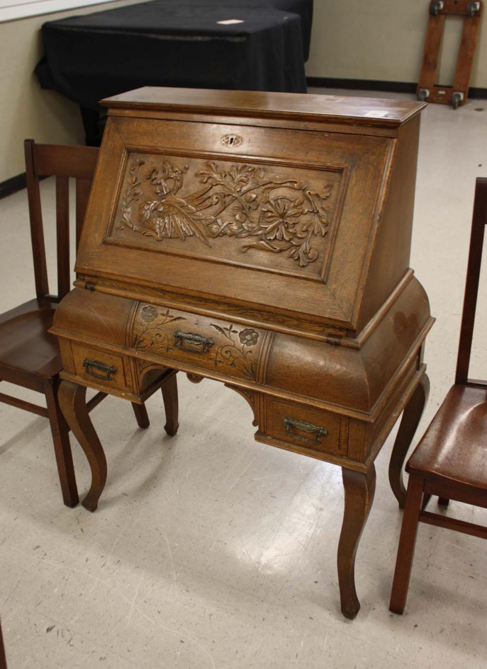 LATE VICTORIAN CARVED OAK SLANT-FRONT