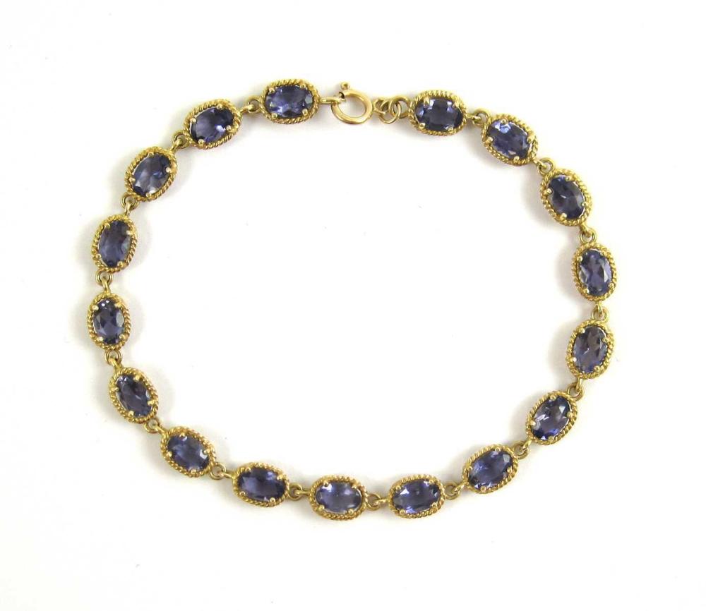 TANZANITE AND FOURTEEN KARAT GOLD