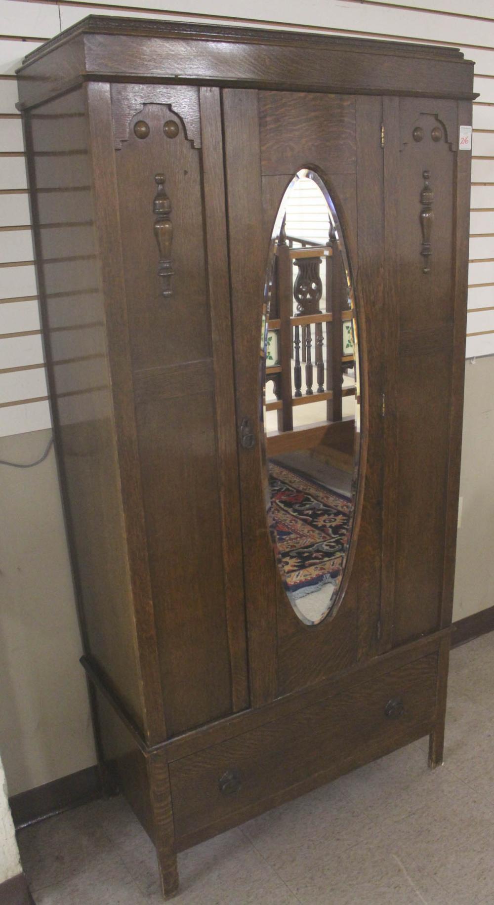 AN OAK SINGLE-DOOR WARDROBEAN OAK