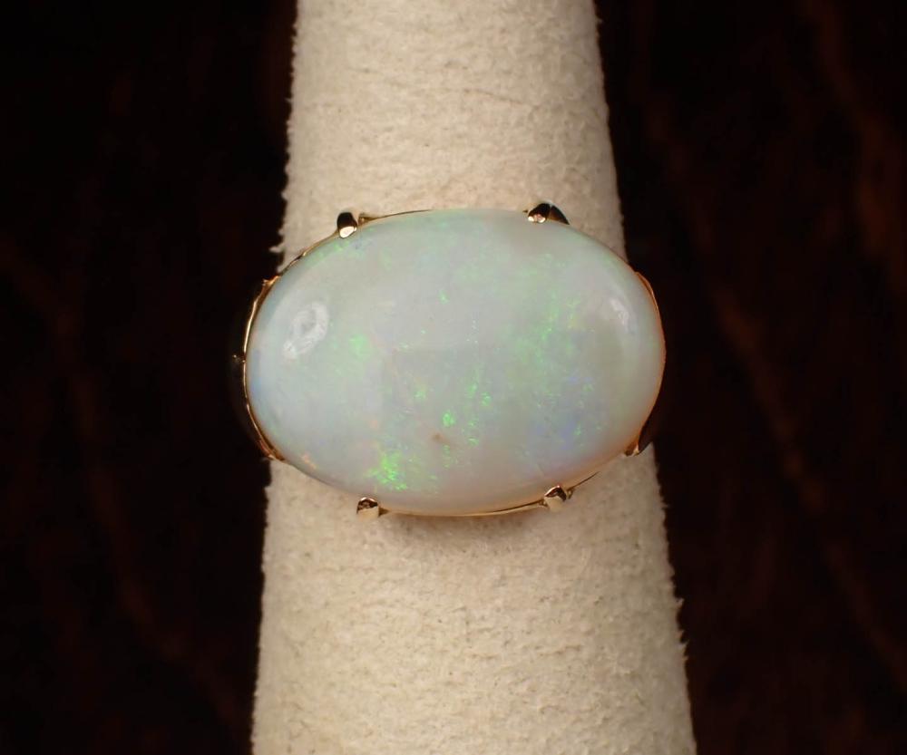 OPAL AND FOURTEEN KARAT GOLD SOLITAIRE 341a56