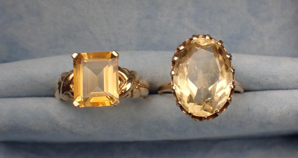 TWO CITRINE AND YELLOW GOLD SOLITAIRE