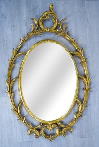 OVAL GILT MIRROR WITH FOLIATE SURROUNDOval