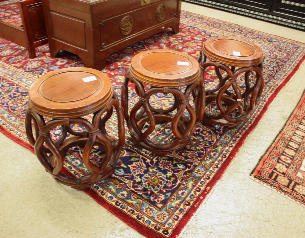 A SET OF THREE ROSEWOOD STOOLSA