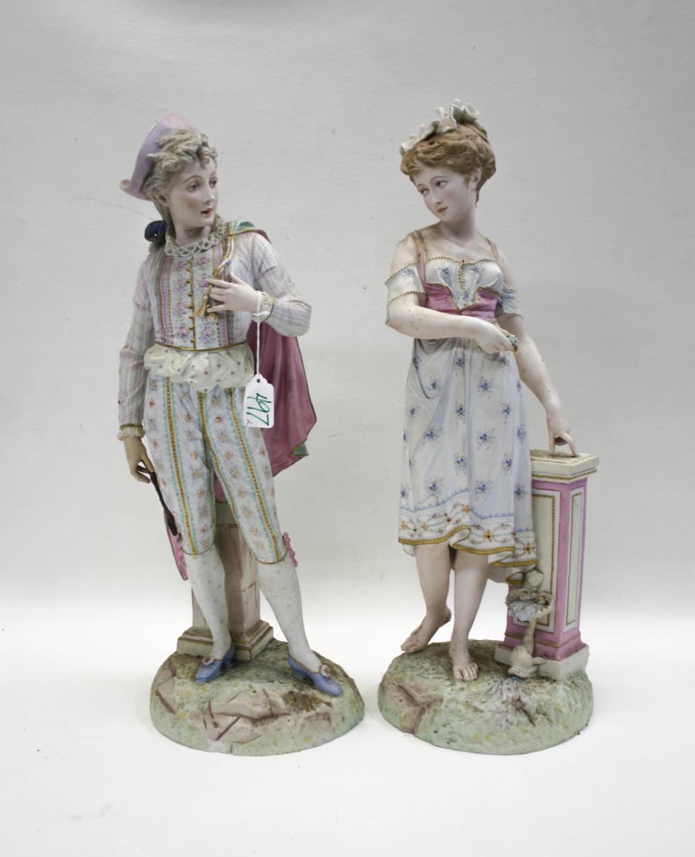 PAIR OF PAINTED BISQUE PORCELAIN FIGURESPAIR