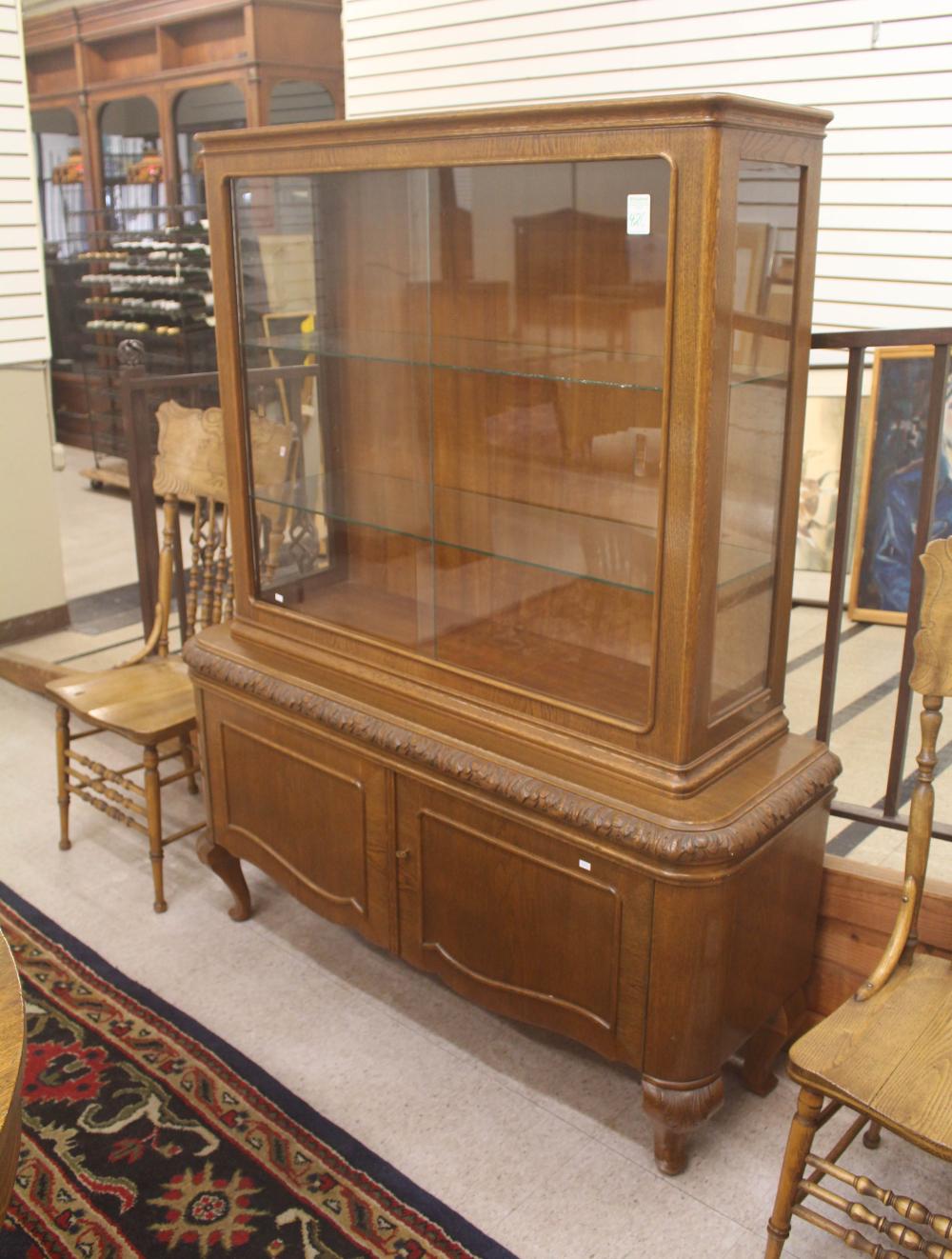 AN OAK AND GLASS CHINA CABINET