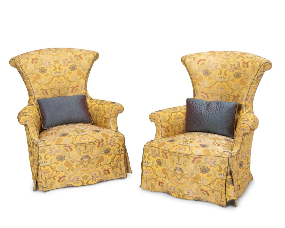 A PAIR OF UPHOLSTERED ARMCHAIRSA