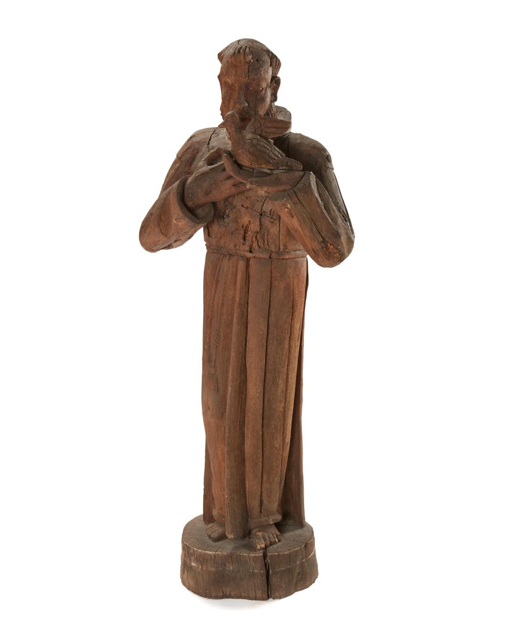 A LARGE CARVED WOOD SCULPTURE OF ST.