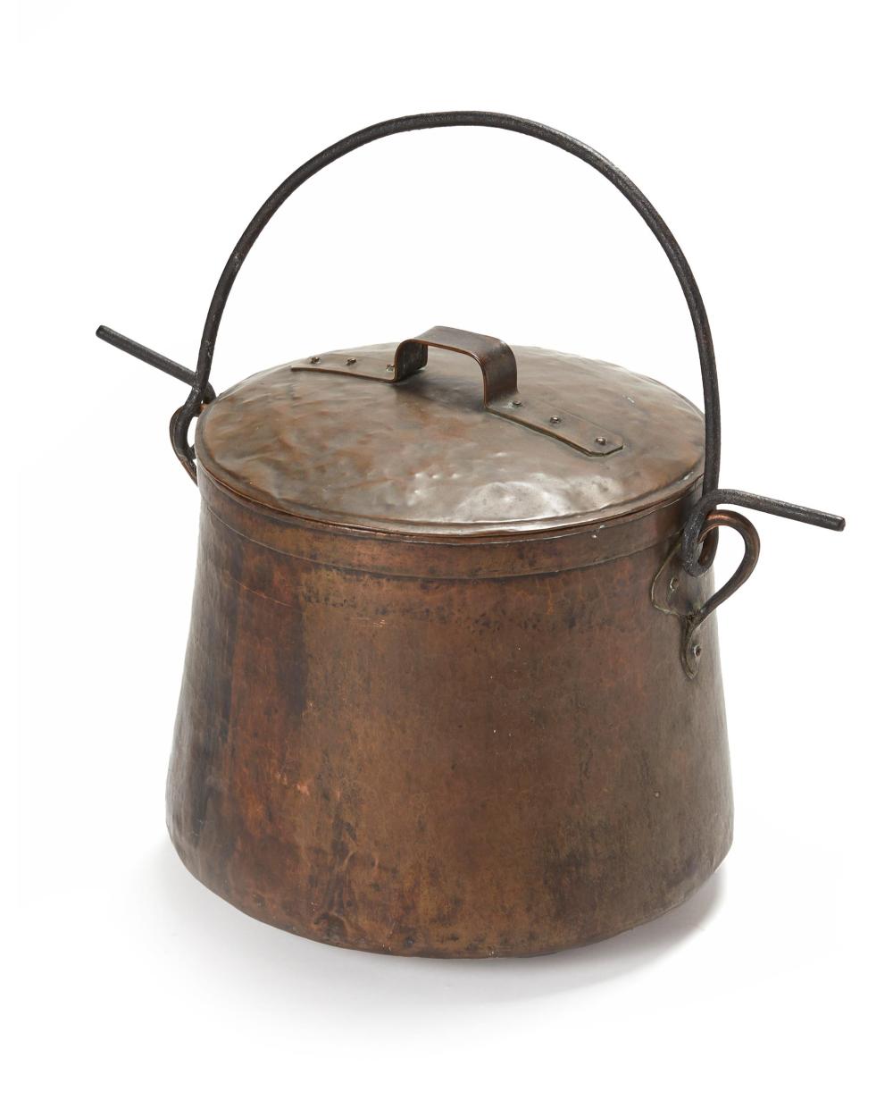 A LARGE HAMMERED COPPER AND IRON COOKING