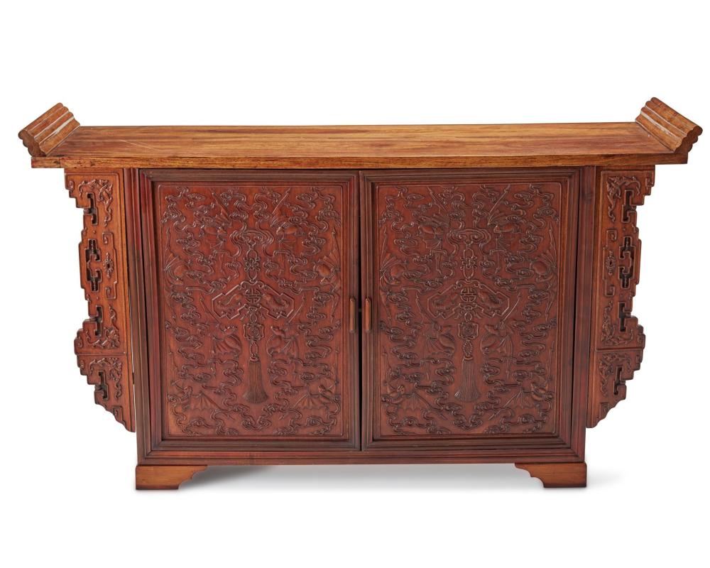 A CHINESE CARVED WOOD CABINETA