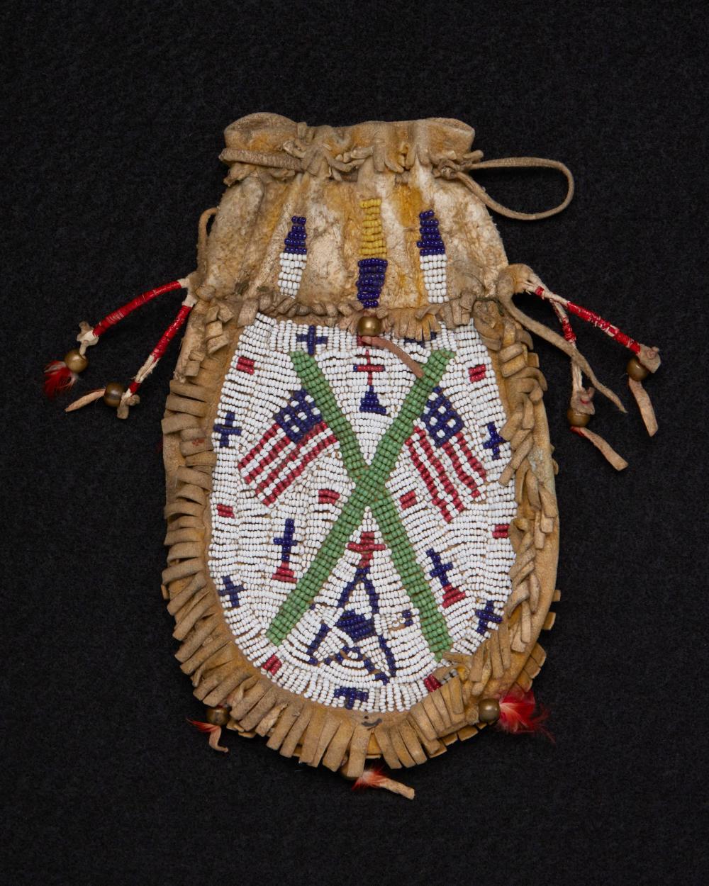 A SIOUX BEADED HIDE FLAG BAGA Sioux