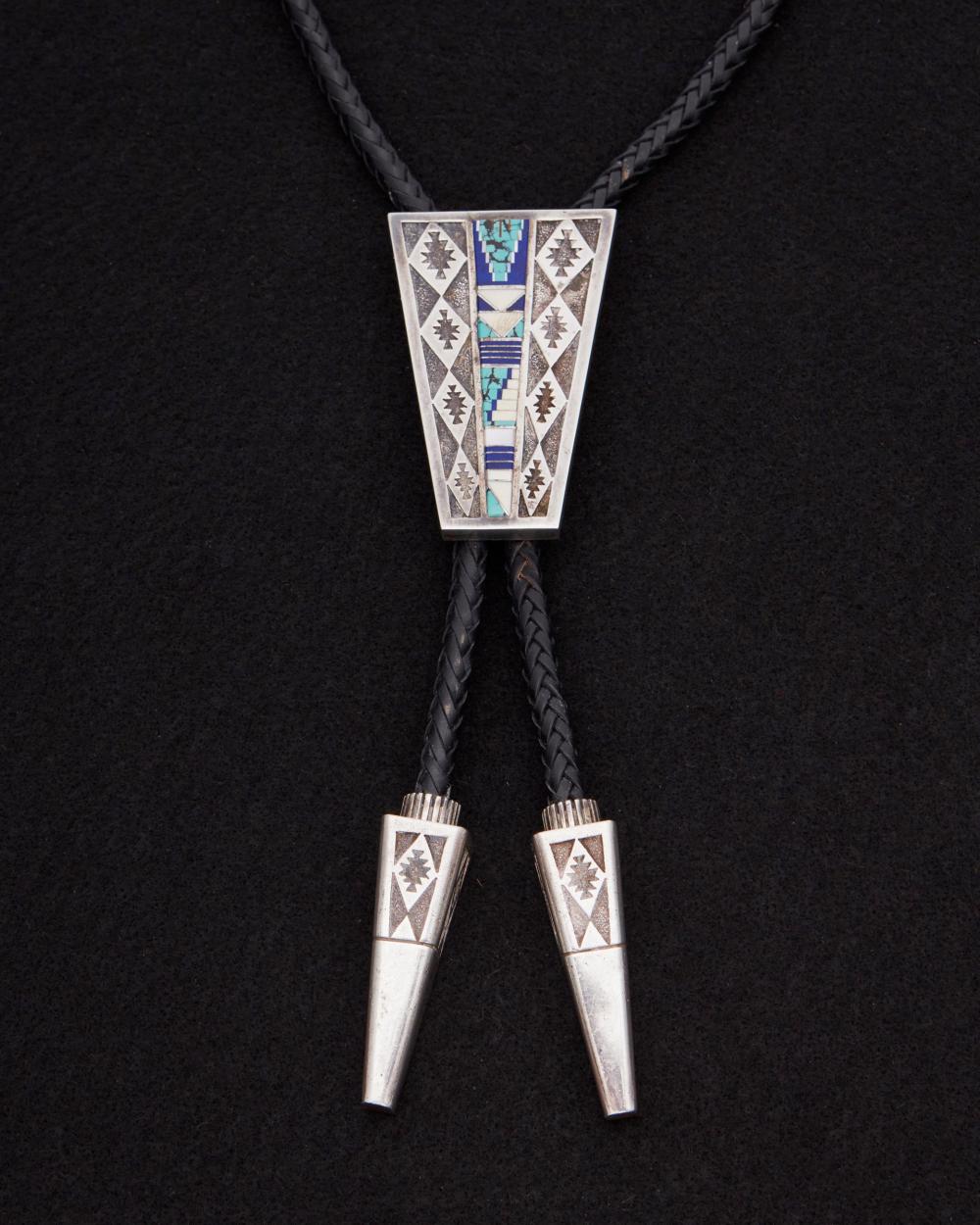 AN ABRAHAM BEGAY INLAID SANDCAST 34472c