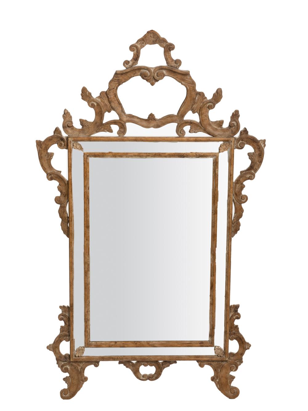 AN ITALIAN CARVED WOOD WALL MIRRORAn