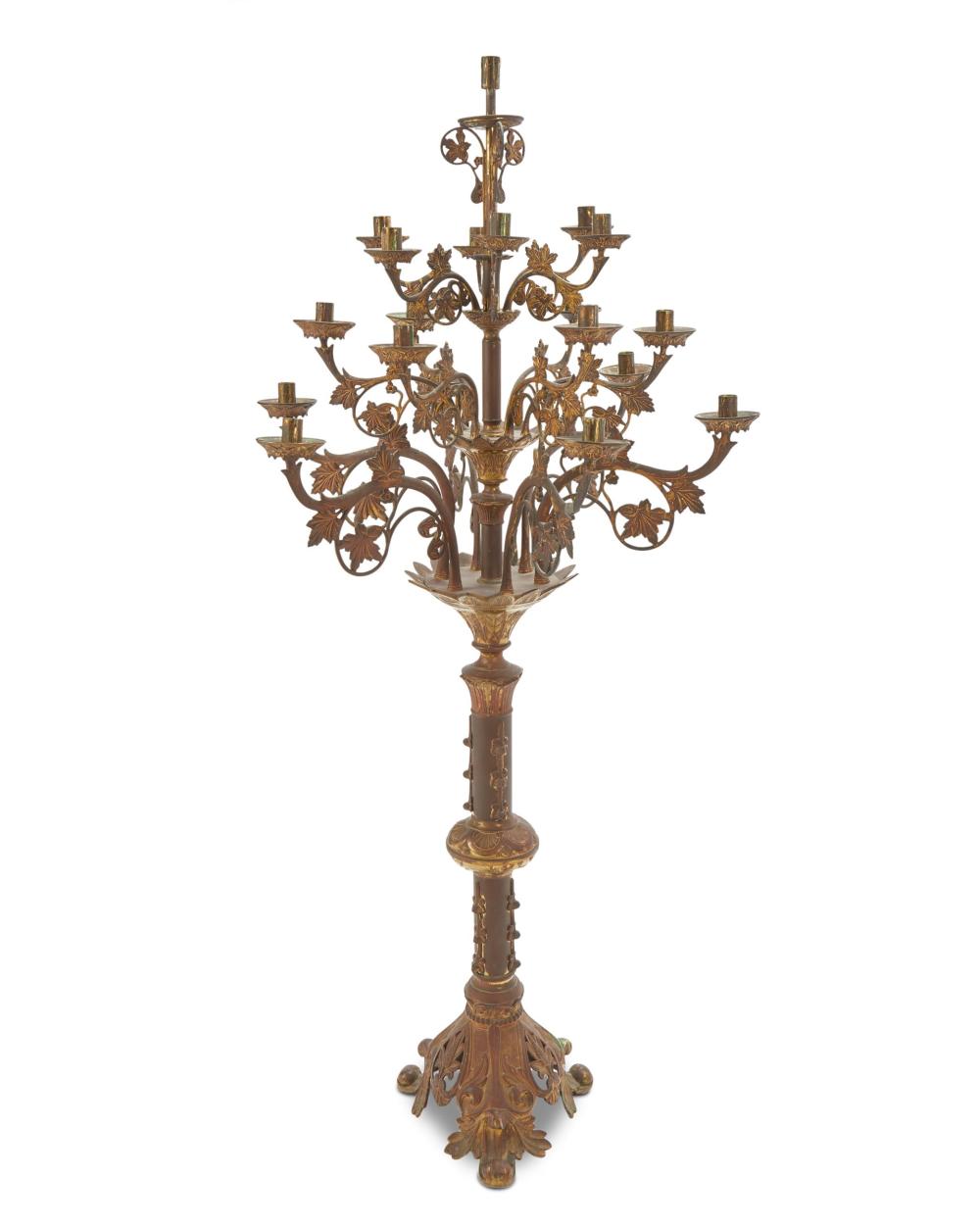 A TALL GILT-BRONZE STANDING CANDELABRUMA