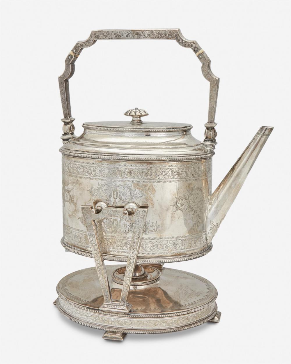 AN ENGLISH STERLING SILVER TILTING KETTLEAn