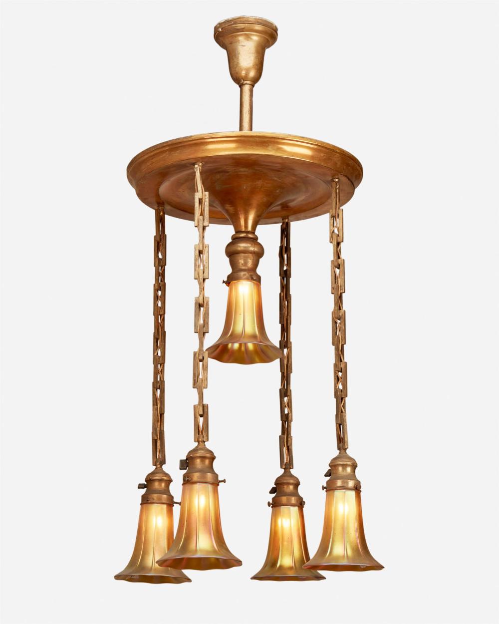 A GILT-METAL CHANDELIER WITH STEUBEN