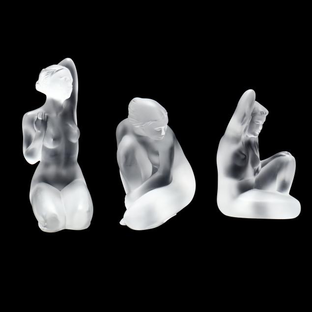 THREE LALIQUE CRYSTAL SEATED NUDE FIGURES