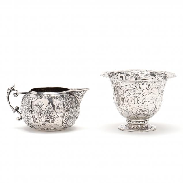 A DUTCH REPOUSSE SILVER CREAMER 345338