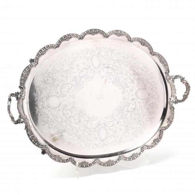 A LARGE SILVER-PLATED OVAL TRAY