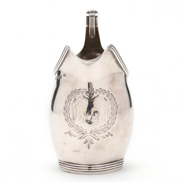 A GEORGE III SILVER CREAMER With