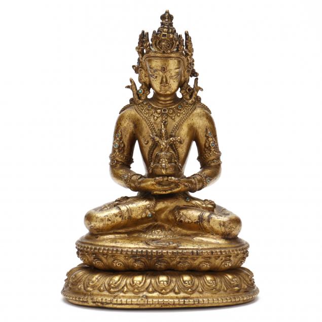  A NEPALESE GILT COPPER ALLOY SCULPTURE