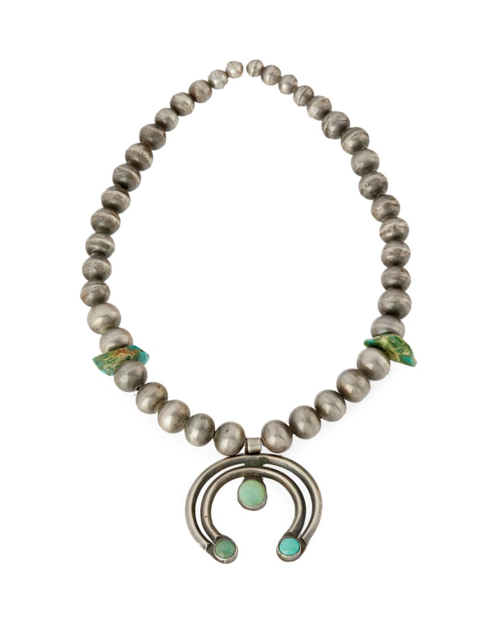 A NAVAJO SILVER AND TURQUOISE NECKLACEA 343060