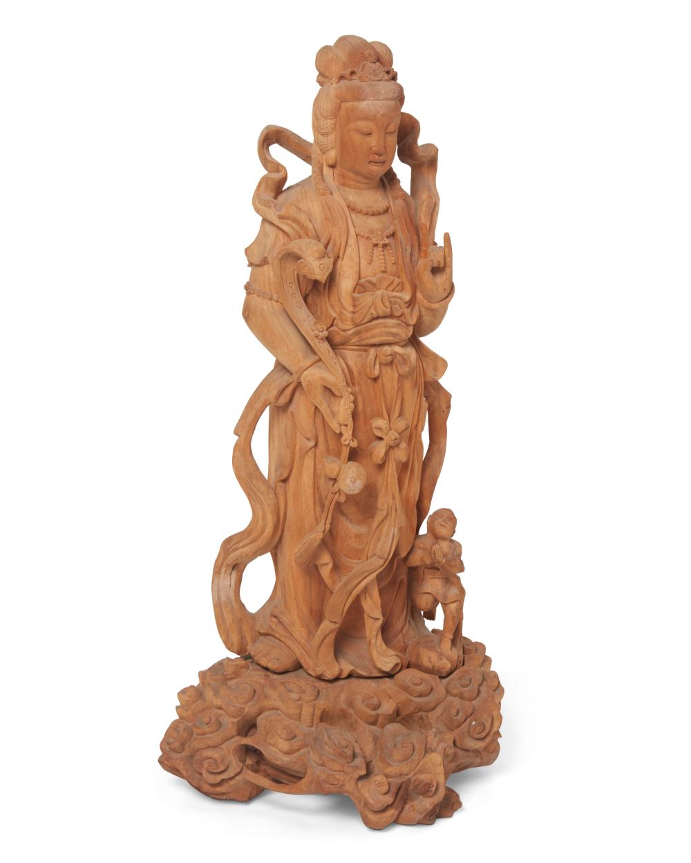 A CHINESE CARVED CAMPHOR WOOD FIGURE