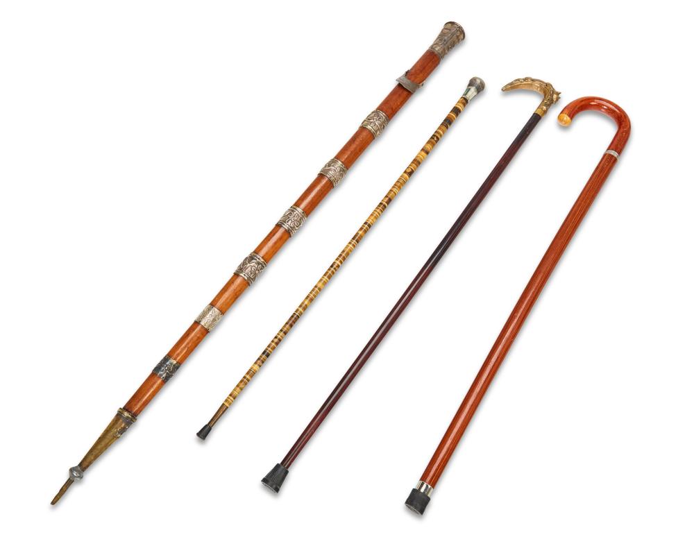 A GROUP OF WALKING STICKS AND CANESA 3432d2