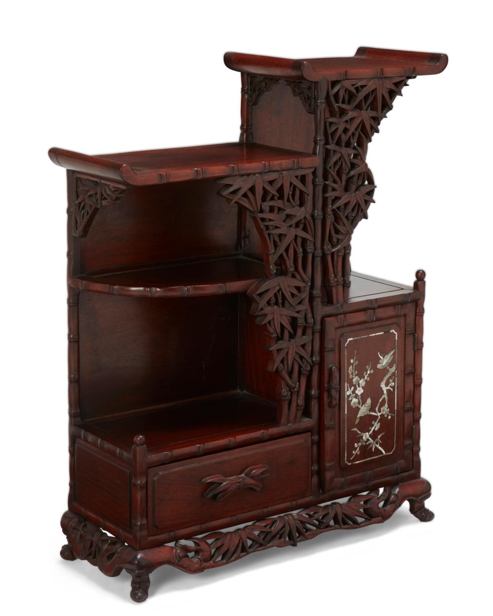 AN EAST ASIAN CARVED WOOD DISPLAY CABINETAn