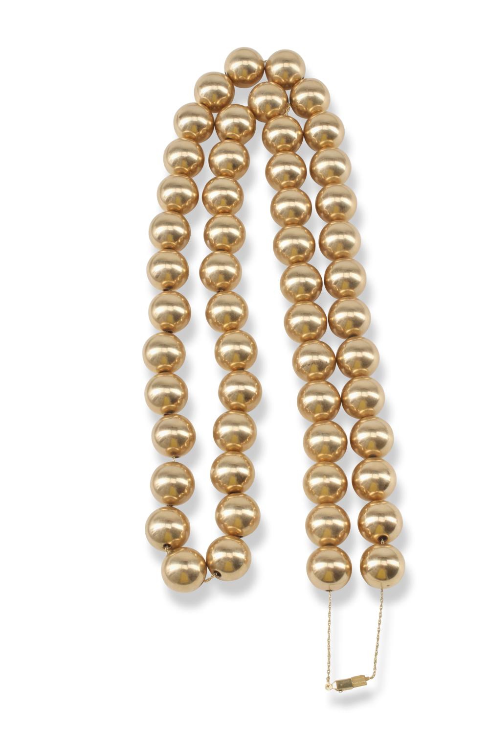A GOLD BEAD NECKLACEA gold bead