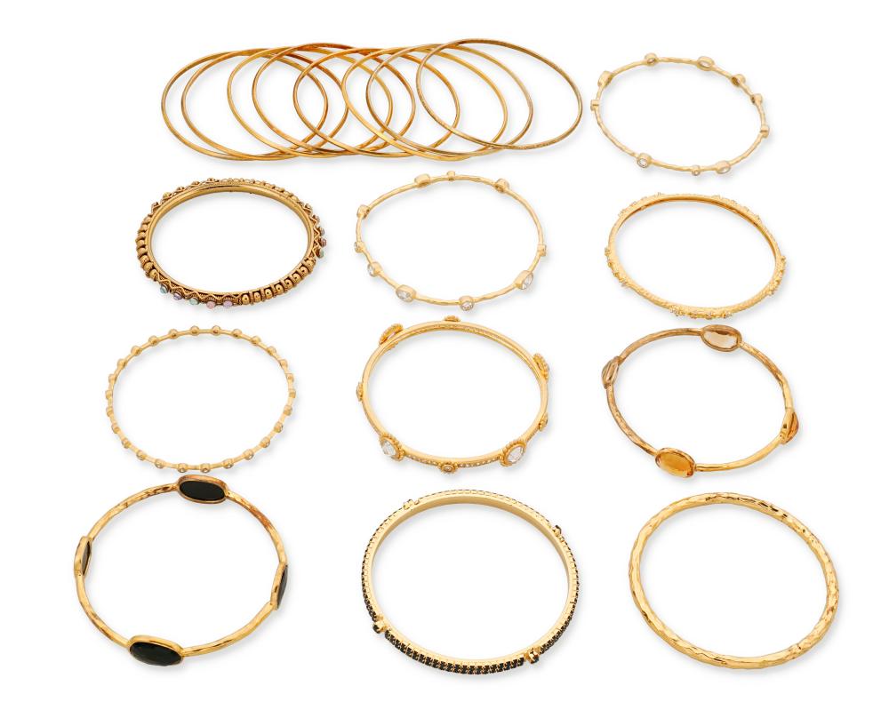 A GROUP OF GOLD-TONED BANGLE BRACELETSA