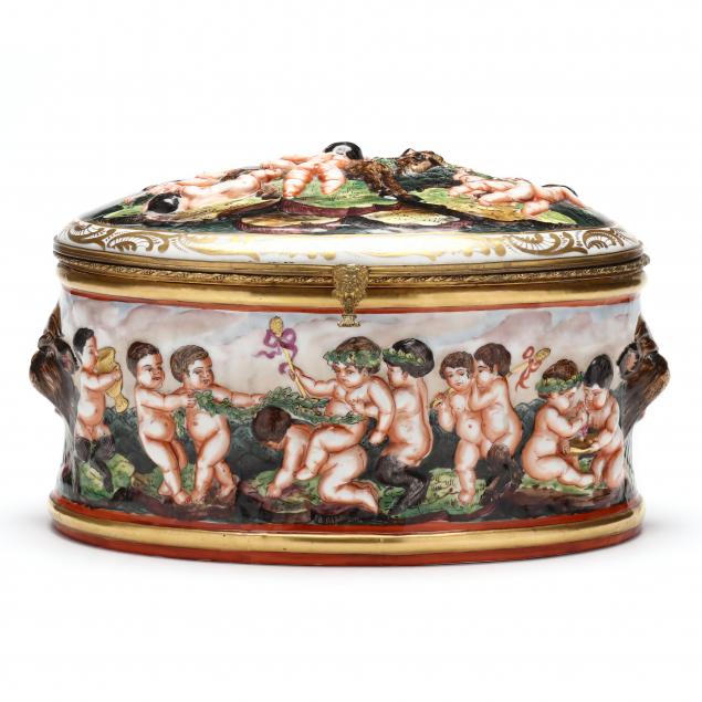 A LARGE OVAL CAPODIMONTE COVERED
