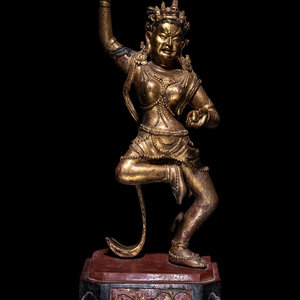 A Tibetan Gilt Lacquered Wood Figure